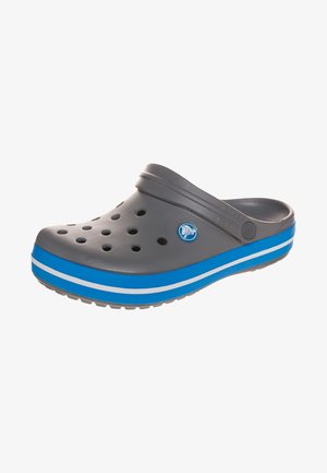 Gray plastic clog with blue and white striped sole, featuring multiple ventilation holes and a curved back strap for a secure fit.