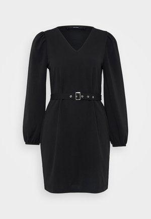 Black dress with a V-neck, puff sleeves, and a defined waistline accentuated by a belt featuring silver hardware and eyelets. Smooth fabric texture.