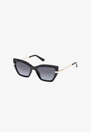 Black cat-eye sunglasses with patterned top frame, gradient dark lenses, and gold metal accents on temples. Smooth, glossy finish.