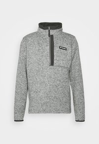 Pullover grigio in felpa con zip a un quarto, colletto alto e tasca sul petto. Presenta un motivo testurizzato e accenti neri a contrasto.