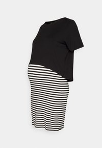 Robe de maternité avec un haut noir, manches courtes, et une jupe rayée noir et blanc. Tissu doux, cintrée à la taille, coupe fuselée.