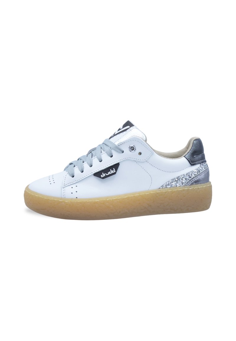 White leather sneakers with light gray laces and a gum sole. Features a silver accent at the heel and a black logo on the side.
