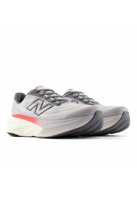 Light gray running shoes with breathable mesh upper, feature red accents and a white midsole. Rounded sole design with textured black outsole.