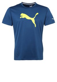 Marinblå träningströja med korta ärmar, prydd med en stor gul Puma-logotyp framtill och en liten logotyp på vänster ärm.