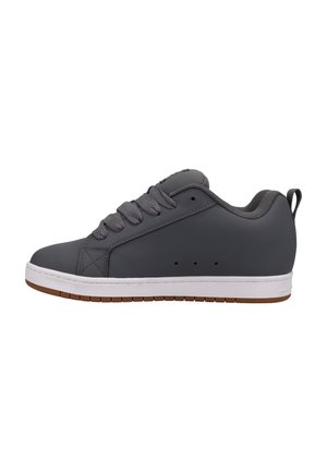 Gray sneaker with a smooth synthetic upper, round toe, and prominently laced front. Features a white midsole and brown rubber outsole.