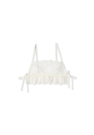 Bralette en dentelle blanche avec fines bretelles, bords festonnés, broderie florale et détails de nœuds latéraux sur fond blanc uni.