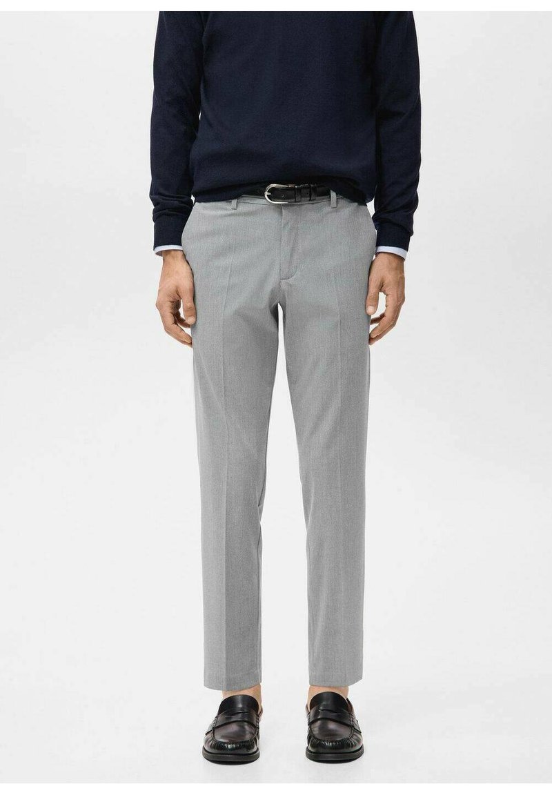 Gray tailored trousers with a straight fit, featuring a flat front, belt loops, and a smooth texture, paired with black slip-on shoes.