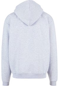 Light grey hooded sweatshirt with a textured fabric, ribbed cuffs, and waistband. Features a central seam on the back and a spacious hood.