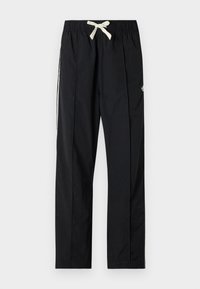Black, lightweight pants with a relaxed fit, elastic waistband, and drawstring. Features white side stripes and a small logo on the thigh.