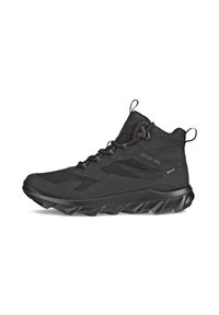 Scarpe da trekking nere con una tomaia in materiale sintetico testurizzato, dettagli in mesh e una suola robusta con lugs di trazione pronunciati. Presentano lacci elastici.