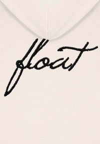 Felpa con cappuccio color beige chiaro, con la scritta nera ricamata "float" in evidenza sul petto. Realizzata in morbido cotone misto, presenta un design minimalista.