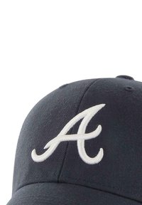 Navy baseball cap made of cotton, featuring a prominent white embroidered "A" logo on the front. Structured shape with a rounded brim.