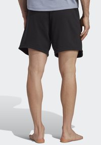 adidas Performance YOGA BASE - Sports shorts - black/carbon