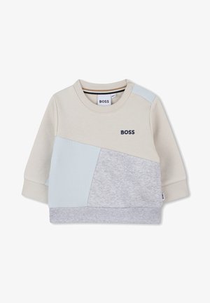 Lichtbeige sweatshirt met ribbelstructuur en grijze accenten. Kenmerkt zich door een driehoekig patchworkontwerp en een marineblauw logo op de voorkant.