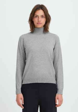 Gray turtleneck sweater in a soft knit material, featuring long sleeves and ribbed hems, paired with dark trousers.