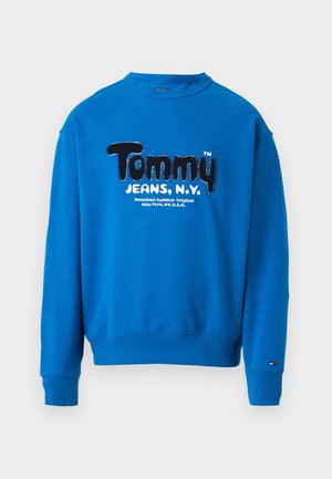 Sweatshirt azul com gola redonda, apresentando um logo texturizado em preto e branco "Tommy JEANS, N.Y." na frente e punhos e bainha canelados.