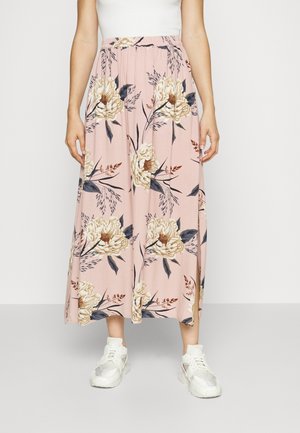 Blomster midi nederdel i blød pink med store cremefarvede pæoner og bladrankede detaljer. Har en elastisk talje og sideslidser for nem bevægelse.