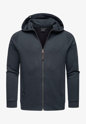 Felpa con zip grigio scuro realizzata in tessuto morbido, dotata di cappuccio, tasche frontali e polsini a coste. Include una zip con un accento metallico.