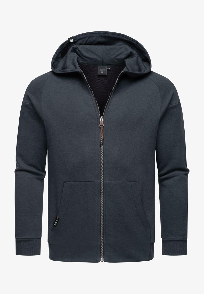 Sudadera con cremallera de color gris oscuro, hecha de un tejido suave, con capucha, bolsillos frontales y puños de canalé. Incluye una cremallera con un acento metálico.