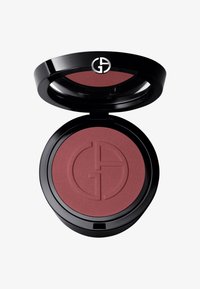 Rund kompakt blush med svart emballasje, som har en matt burgunderfarge innvendig, preget med et logo-mønster. Åpnes med hengsel.