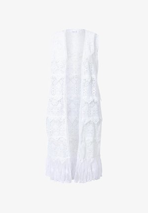 Chaleco blanco de encaje con apertura frontal, que presenta patrones intrincados y un dobladillo con volantes. Textura ligera y aireada sin mangas.