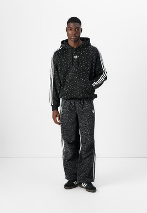 Rankning 3: adidas Originals - GRAPHIC UNISEX - Träningsbyxor