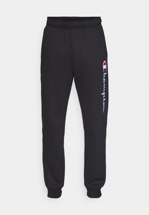 Pantaloni da jogging neri con elastico in vita, polsini a stringere e logo "Champion" bianco stampato lungo la gamba sinistra. Realizzati in materiale morbido.