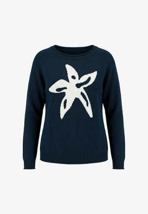 Pull bleu marine à manches longues avec un grand motif abstrait d’étoile de mer blanche centré sur la poitrine.