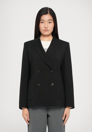 Black double-breasted blazer with notched lapels, featuring two front pockets and button closures. Smooth fabric and tailored fit.