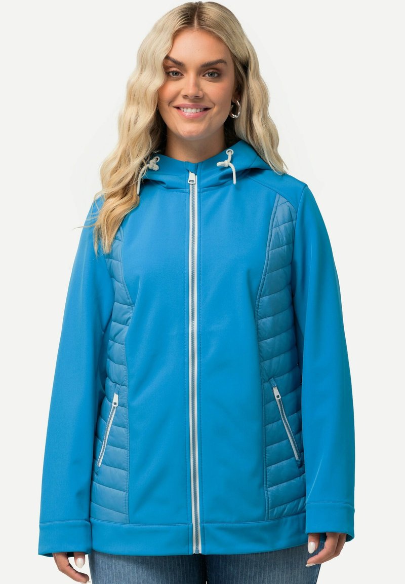 Blå huvjacka med ett quiltat mönster på sidorna, dragkedjestängning och två framfickor. Den har en slät yta och kontrasterande detaljer.