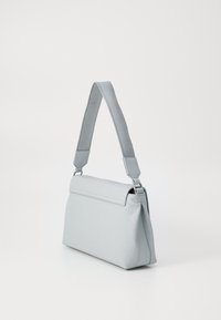 Light blue handbag with a smooth, textured surface. Features a top flap, adjustable strap, and subtle embossed pattern. Rectangular shape.