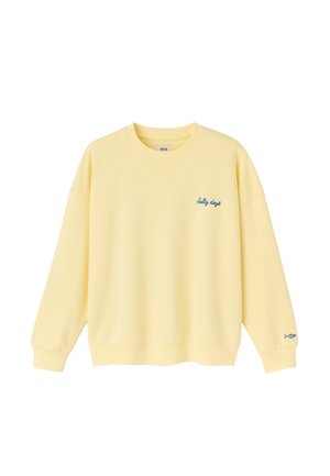 Sweat-shirt jaune clair à col rond avec manches longues, texte bleu "Salty days" sur la poitrine, et petit dessin de poisson près du poignet gauche.