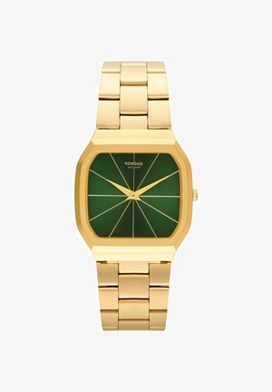 Montre en métal doré avec un boîtier octagonal et un cadran vert. Présente des index et aiguilles dorés avec un motif géométrique sur le visage.