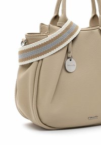 Beige leather handbag with a textured surface, dual top handles, and a patterned shoulder strap featuring gray and brown stripes. Silver hardware detail.