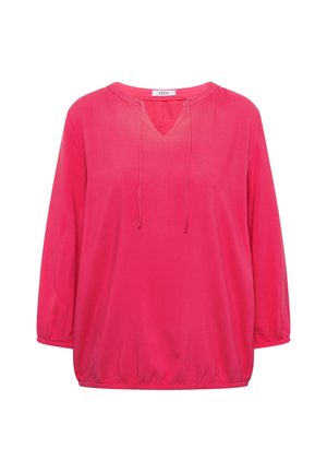 Lyserød bluse med lange ærmer, elastiske manchetter, V-udskæring med snore, og løs pasform.