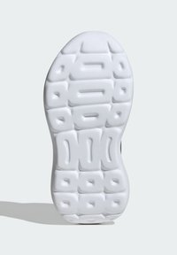 White rubber shoe sole with a textured surface. Features rounded edges and raised geometric patterns for grip and traction.