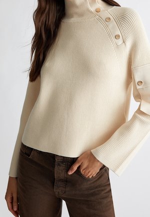 Stickad tröja - beige