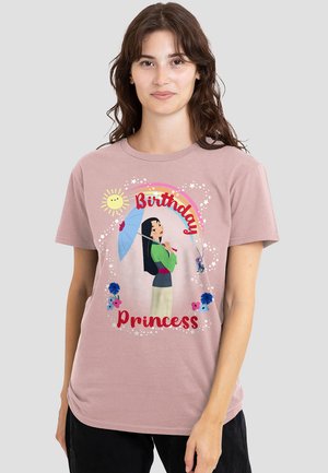Light pink t-shirt featuring a graphic design of a girl with an umbrella, surrounded by flowers and the text "Birthday Princess" in bold red.