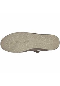 Schuhsohle aus leicht beigem Gummi mit strukturiertem, gemustertem Design, abgerundetem Rand und einem Logo in der Nähe der Ferse.