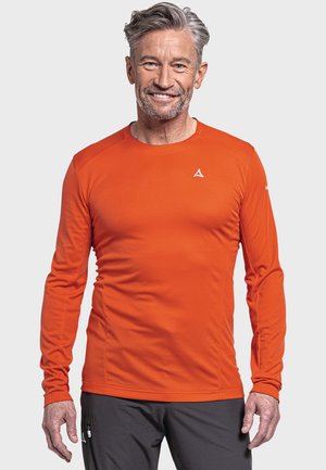 Langärmliges Sportshirt in leuchtendem Orange, aus feuchtigkeitsableitendem Material mit Rundhalsausschnitt und körperbetontem Schnitt. Weißes Logo auf der Brust.