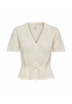 Hellbeiges kurzärmliges Strickoberteil mit V-Ausschnitt, Knopfleiste, Peplum-Taille und Spitze-Musterverzierung. Mit einem Bindeband in der Taille.