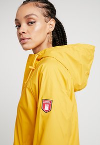 Derbe TRAVEL FRIESE LIFESAVER - Parka - yellow
