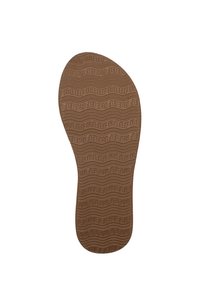 Sottopiede in gomma marrone con un motivo ondulato testurizzato e la scritta "FREE" impressa sulla superficie. Disegnato ergonomicamete per il comfort.