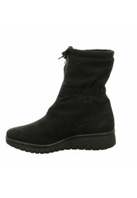 Black ankle boot made of soft suede with a gathered cuff, zipper closure, and a textured rubber sole for traction. Features a slightly elevated heel.