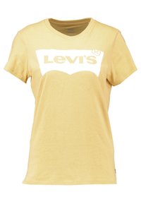 Żółta koszulka Levi's z białym logo umieszczonym na klatce piersiowej. Krótkie rękawy i klasyczny fason z okrągłym dekoltem. Miękka bawełniana tekstura.