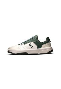 Men's sneakers with a white and dark green design. Features smooth leather, mesh accents, and a white rubber sole with black trim.