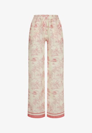 Pantalon de pyjama en coton avec un fond beige clair ornée d'un motif toile rouge représentant des scènes pastorales. Taille élastique et ourlet contrasté.