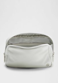 Light gray waterproof cosmetic bag with a zip closure, featuring a smooth texture and a mesh compartment inside. Lululemon logo on side.