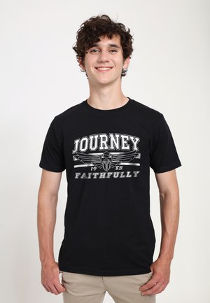 Black cotton t-shirt featuring a graphic print with the text "JOURNEY FAITHFULLY" and a winged design, short sleeves, and a crew neckline.