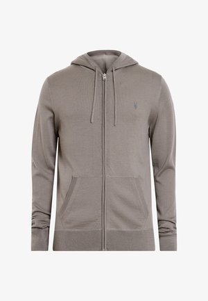 Sudadera con cremallera de color gris claro, con capucha ajustable, puños y dobladillo de canalé, que cuenta con dos bolsillos frontales y un pequeño logo bordado en el pecho.